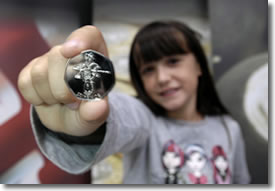 Nine-year-old Florence Jackson with the London 2012 50p she designed for the Royal Mint